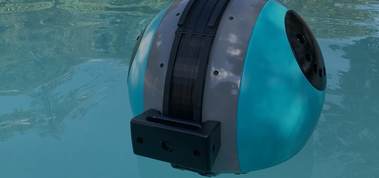 Pengo Cooler Ball floating in a pool